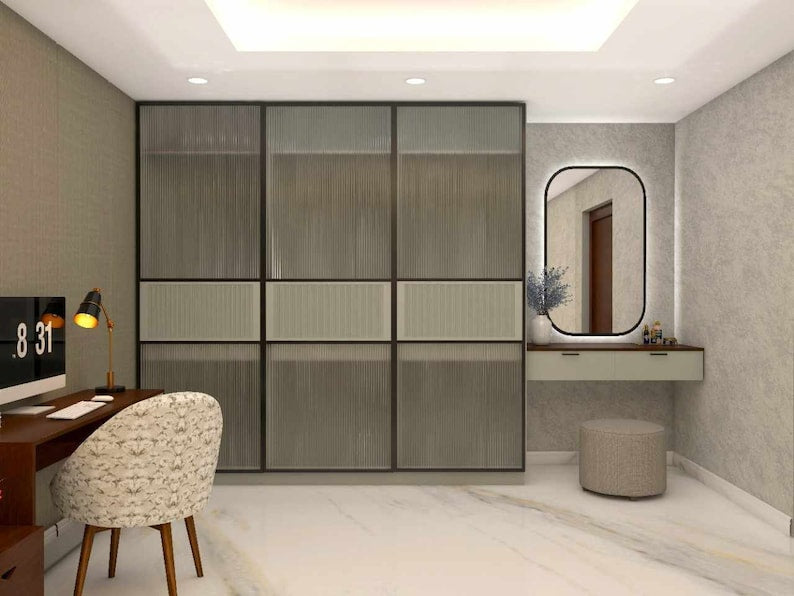 A modern full height sliding wardrobe with fluted glass shutter & dressing unit