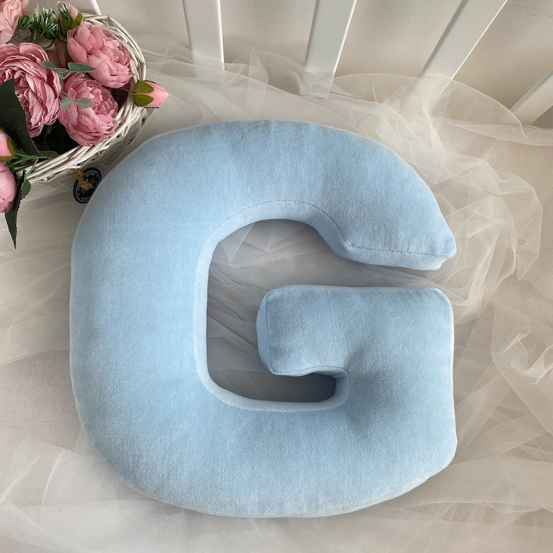 Pink velour decorative pillow in letter shape