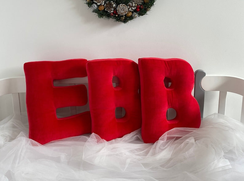 Pink velour decorative pillow in letter shape